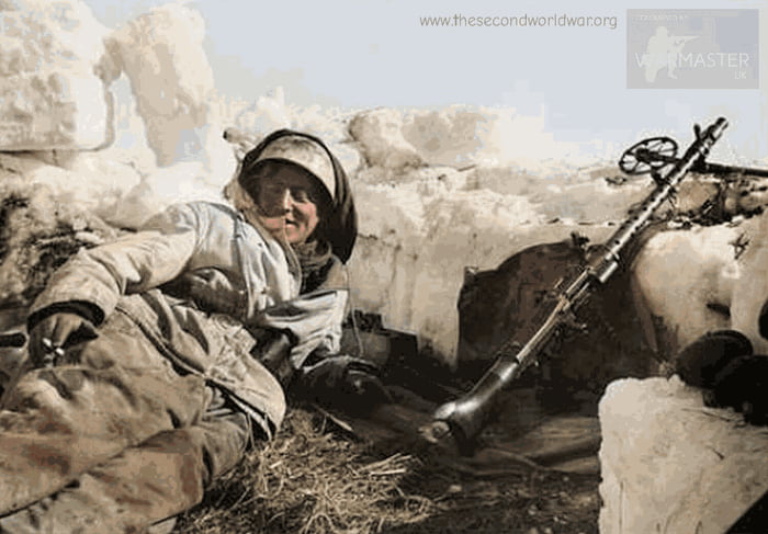 German Fallschirmjäger with his MG 34 machine gun on the ready ...