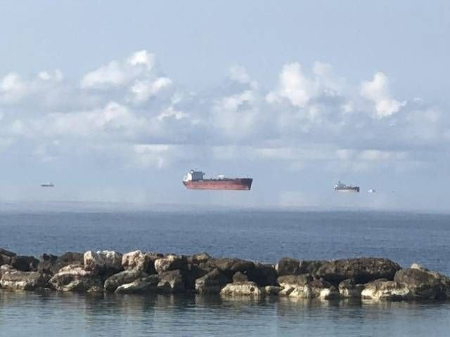 Fata Morgana mirage makes these Black Sea tankers seem to float in mid-air