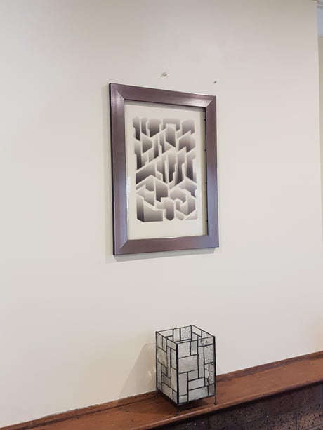 This transparent art print makes the wall look like it has a cool arrangement of holes