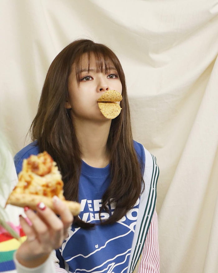 Photo : Fancy era Jeongyeon ft. a slice of pizza. Two things that help make the world go round.