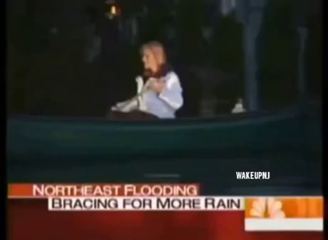 Reporter canoeing in about 6 inches of flood water while 2 guys easily pass through..The Fake Has Never Changed .