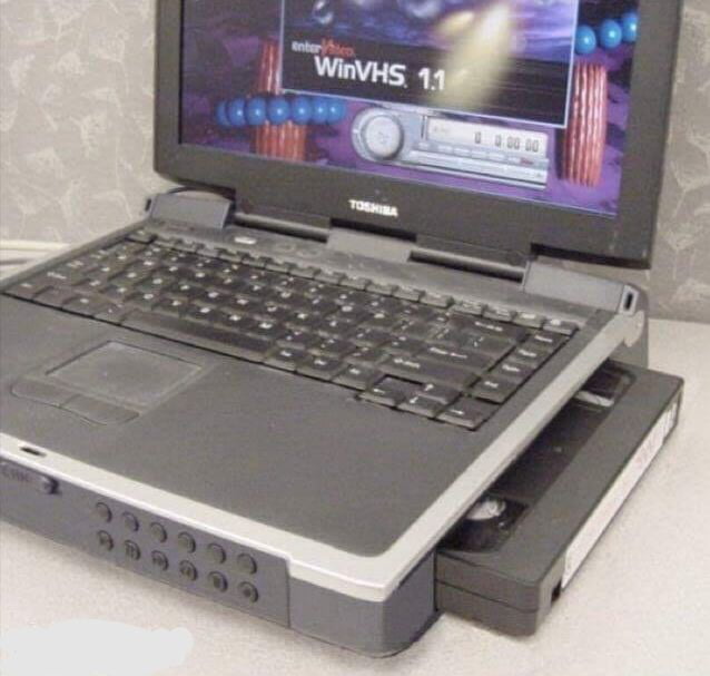 A laptop with a built-in VHS player. Do you feel old yet?