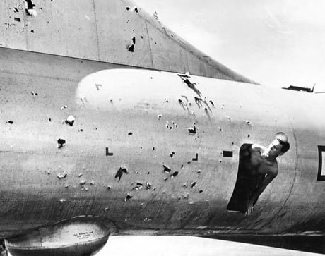 A Crew Member Inspects The Flak Damage To His B29 After A Raid On Tokyo April 1945 9gag