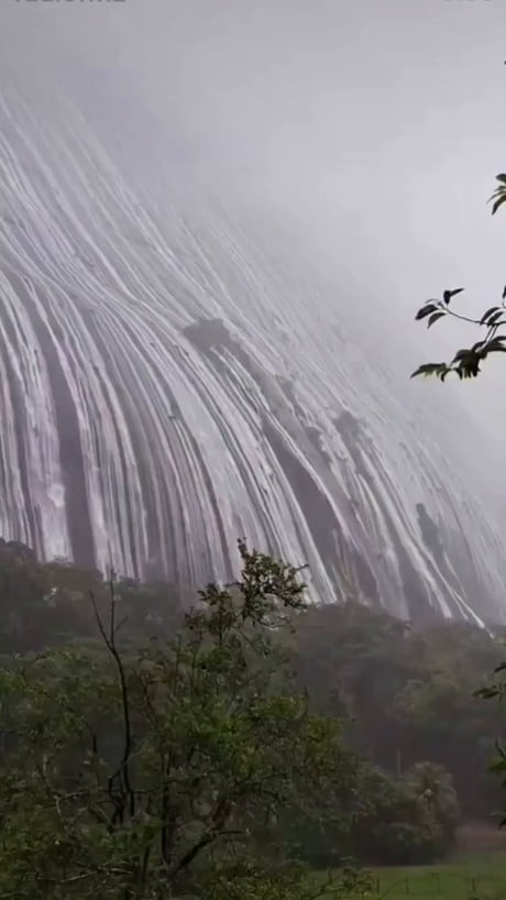 Waterfall over a mountain in Brazil after heavy rainfall. Estrela do norte, Brazil