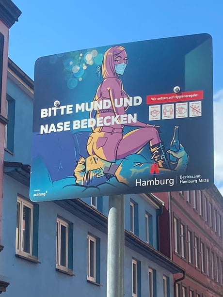 Sign in Hamburg. Cover mouth and nose.