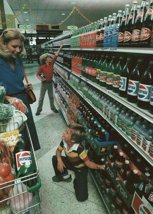 A grocery store in the 1980s. All glass bottles, no plastic in sight.