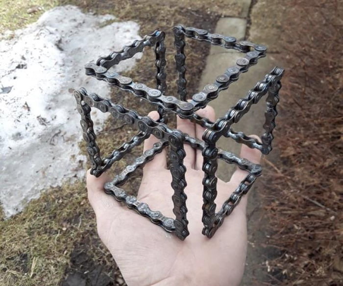 A cube made from a bicycle chain.