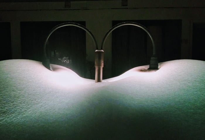 Street lamps through snow