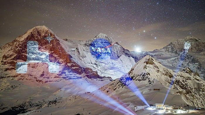 Switzerland celebrates the mars landing by projecting NASA images onto the mountain range.