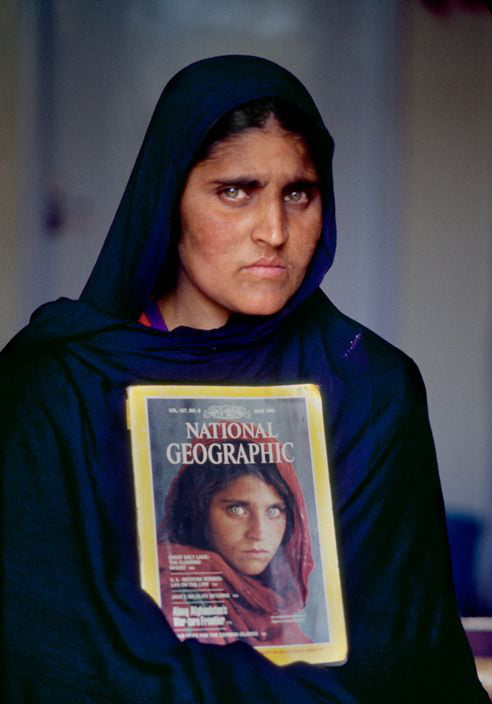 Sharbat Gula National Geographics The Afghan Girl In 2002 Holding The 1984 Issue With Her 7833