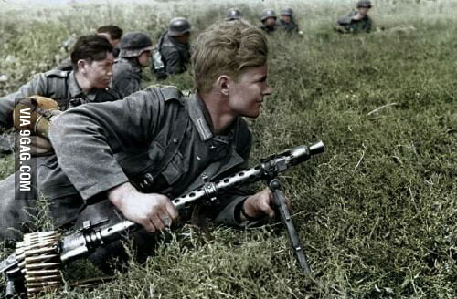 German soldiers taking cover. and you can see one German soldier ...