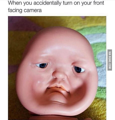 What is the name of the meme face on the phone. - 9GAG