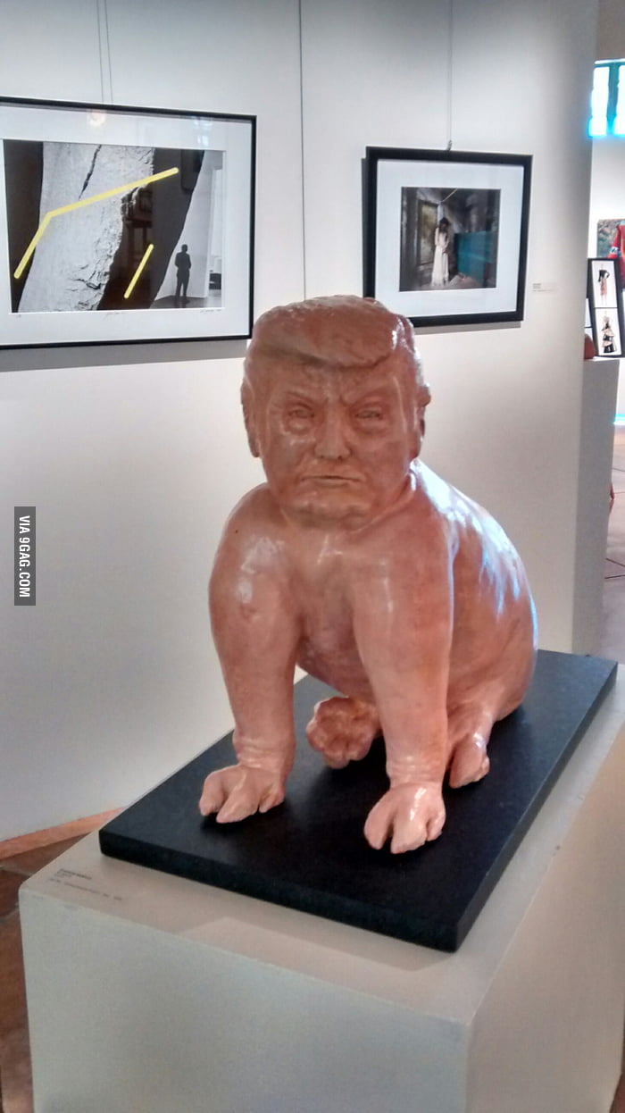 A Donald Trump pig statue in a gallery