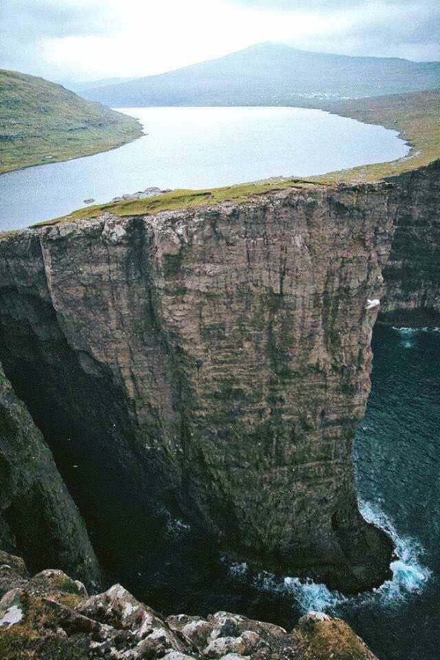 A lake above an ocean, Faroe Islands, Denmark.